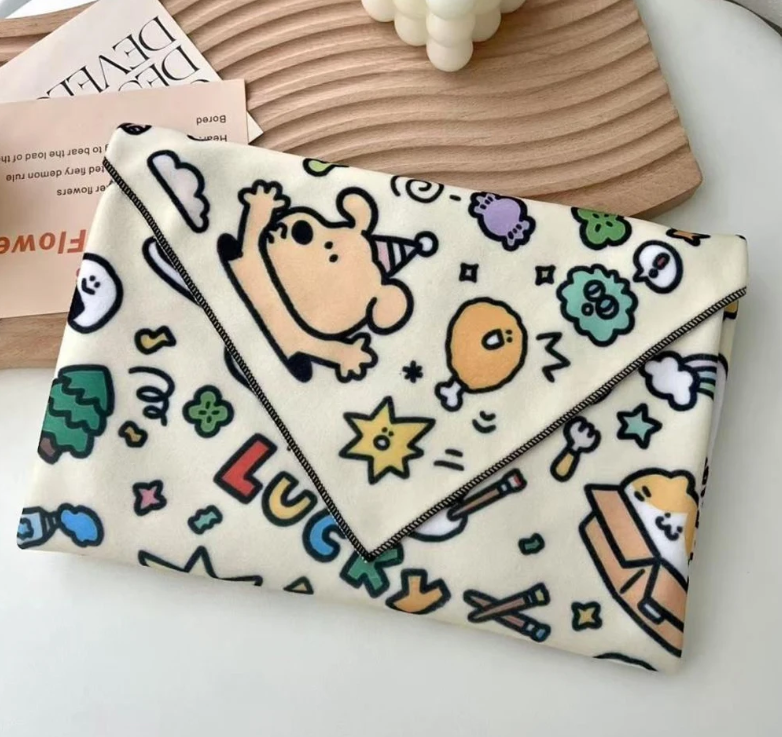 Magic Pet Wrap used as pouch with cartoon character design on a white surface